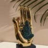 Buddha on Golden Hand Showpiece