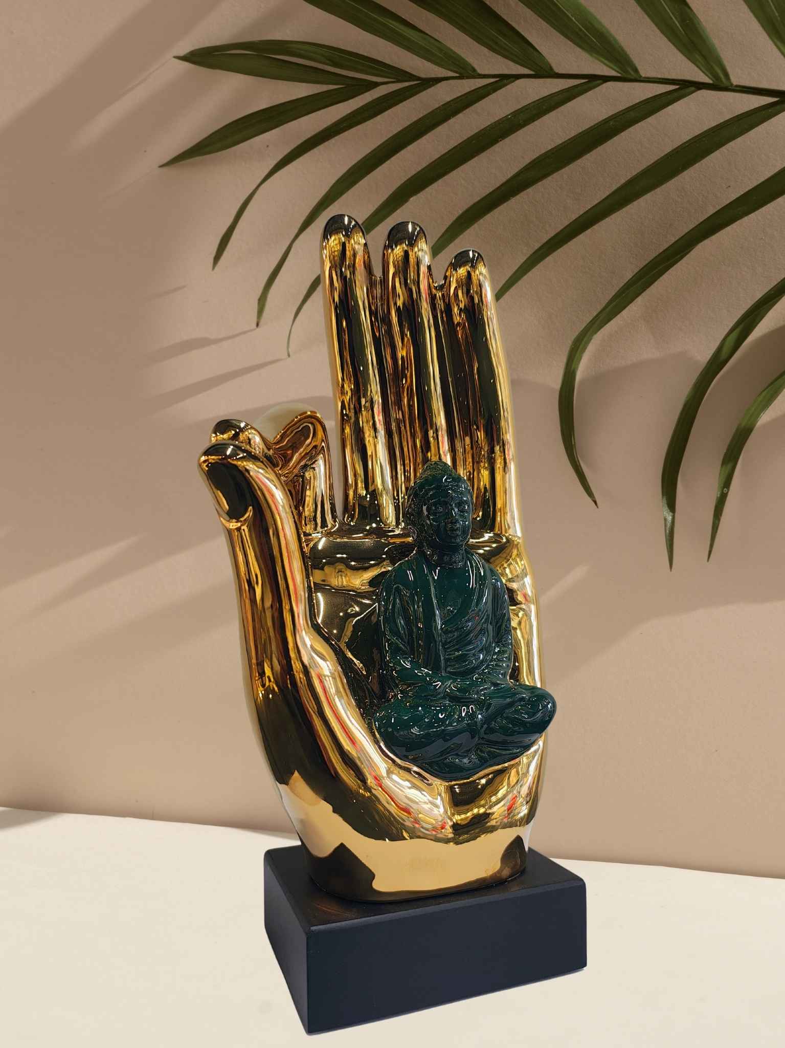 Buddha on Golden Hand Showpiece Buddha on Golden Hand Showpiece