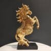 Golden Horse with Front Legs in Air